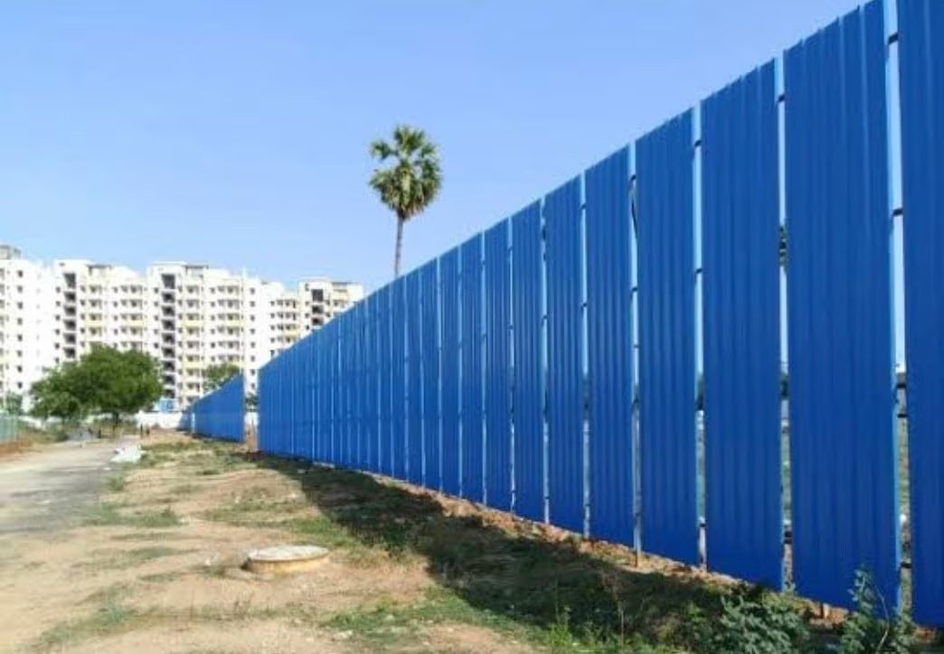 Blue Construction Site Boundary Wall with Corrugated Metal Sheets